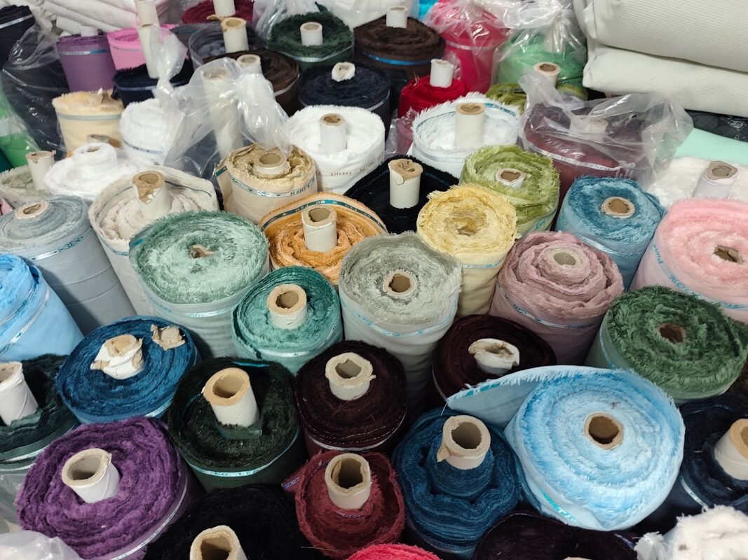 Fabric sourcing and inspection for custom apparel production
